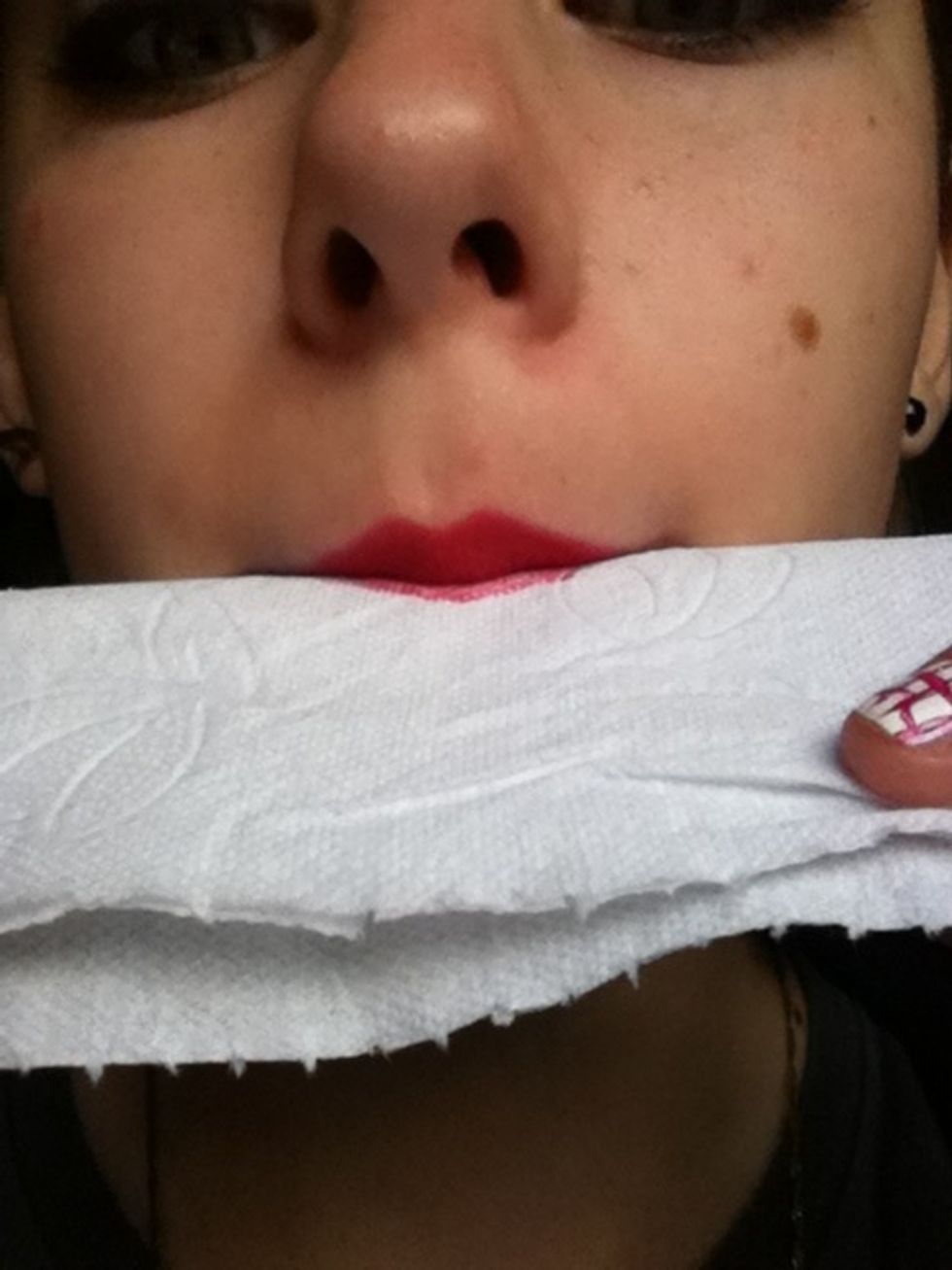 Blot your lips on a clean piece of tissue.