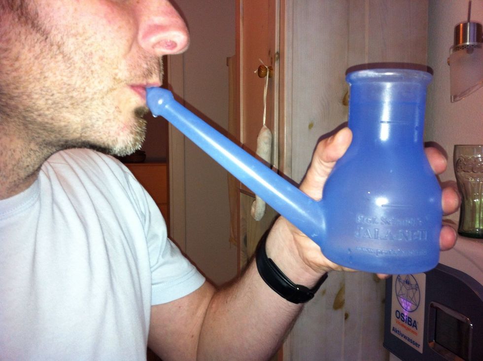 Blow into the nozzle until bubbles come up. This will mix the salted water with the pure water that still resides in the nozzle.