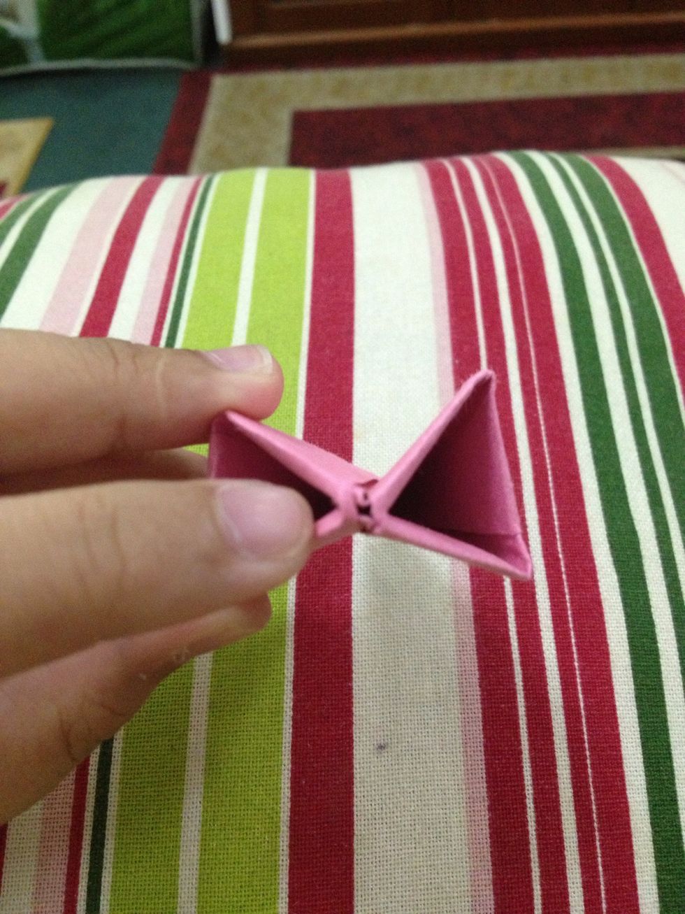 Blow into this hole to inflate it ( where my finger is pointing). Shape the flower after inflating.