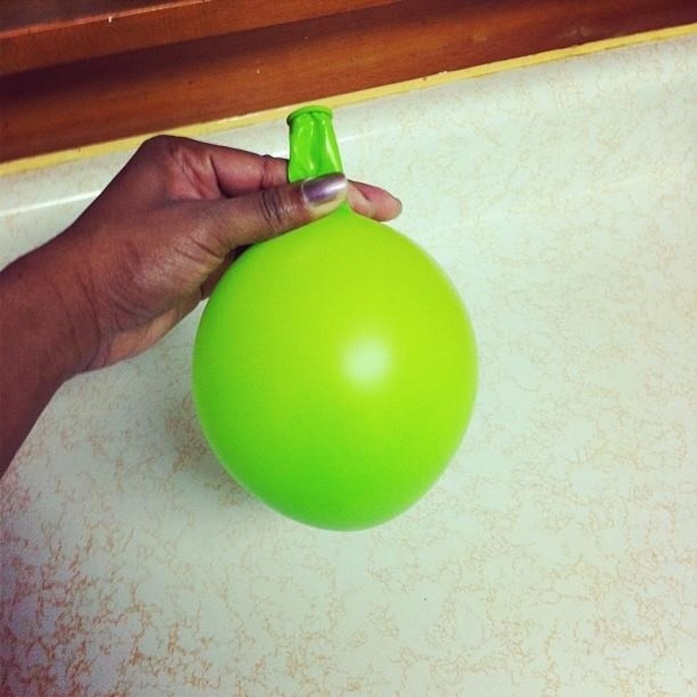 Blow up your balloon to the desired size of your bowl.