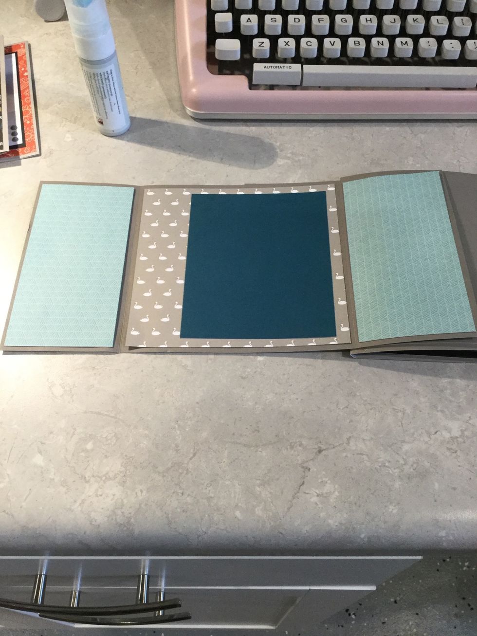 Blue texture paper 2 3/4 X 5 1/2 (cut 2- for each side. Swan texture - 5 3/4 X 5 1/2.  Peacock cardstock- 4 X 5!  Glue as shown!