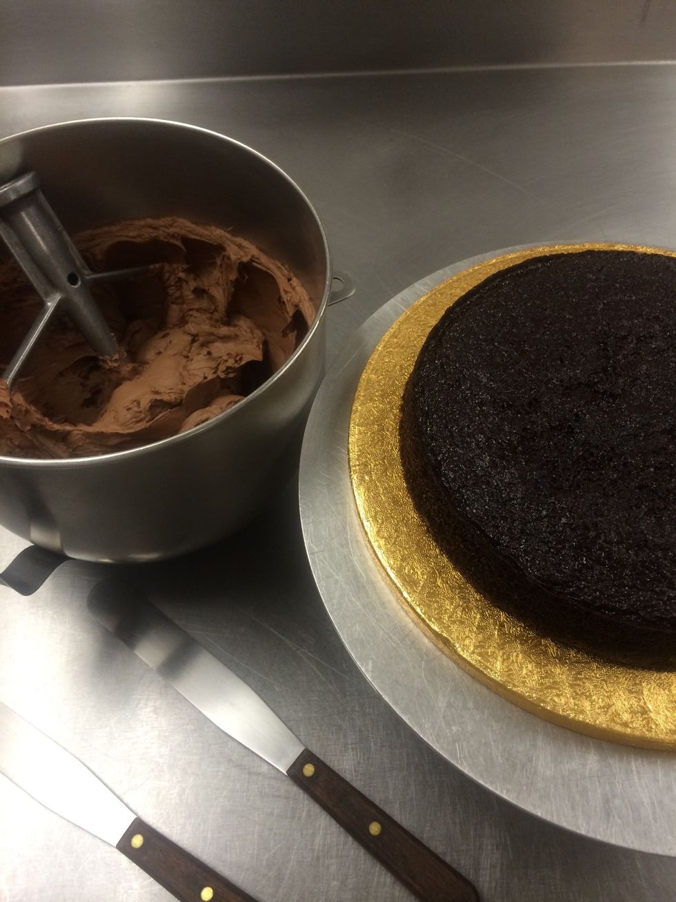 Board, 3 layers of cake ( baked at an earlier time ) filling and frostings are ready.