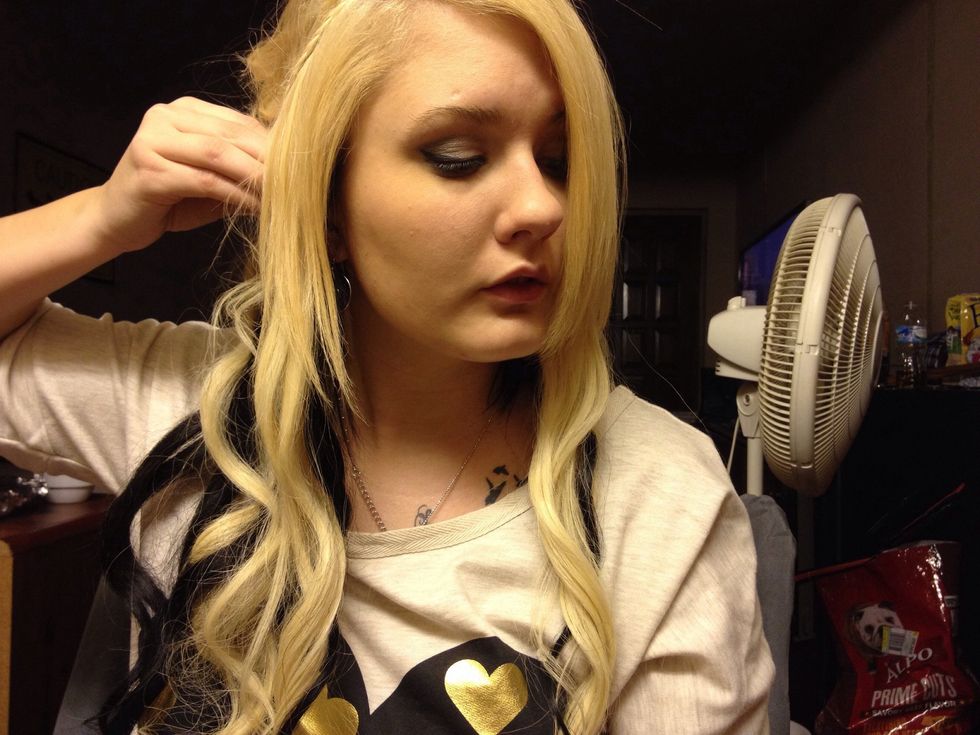 Bobby pin it to your head. You may need to use 2