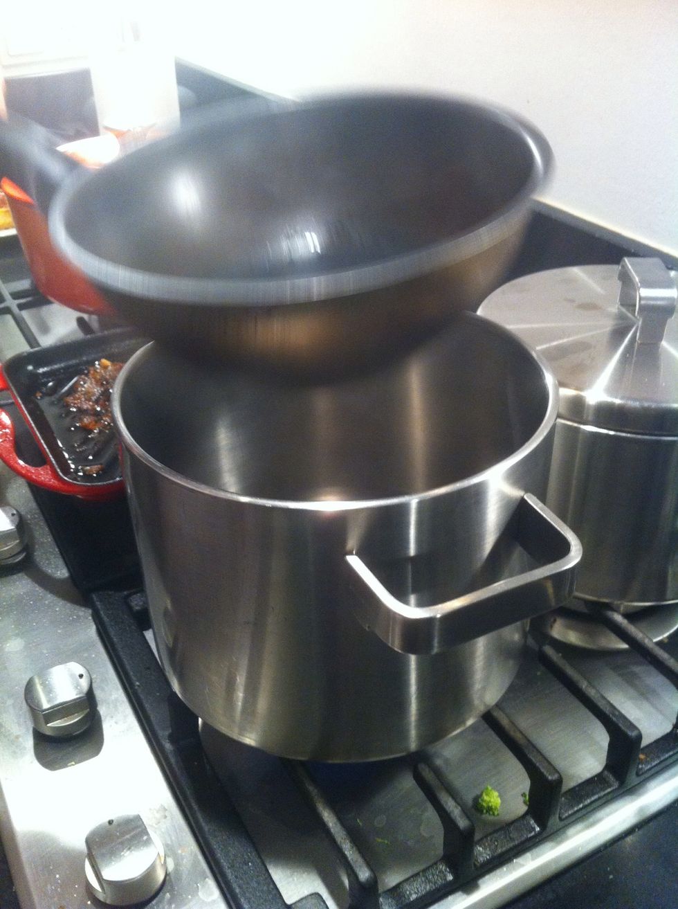 Boil 150ml water in a cooking pan and place a frying pan on top.