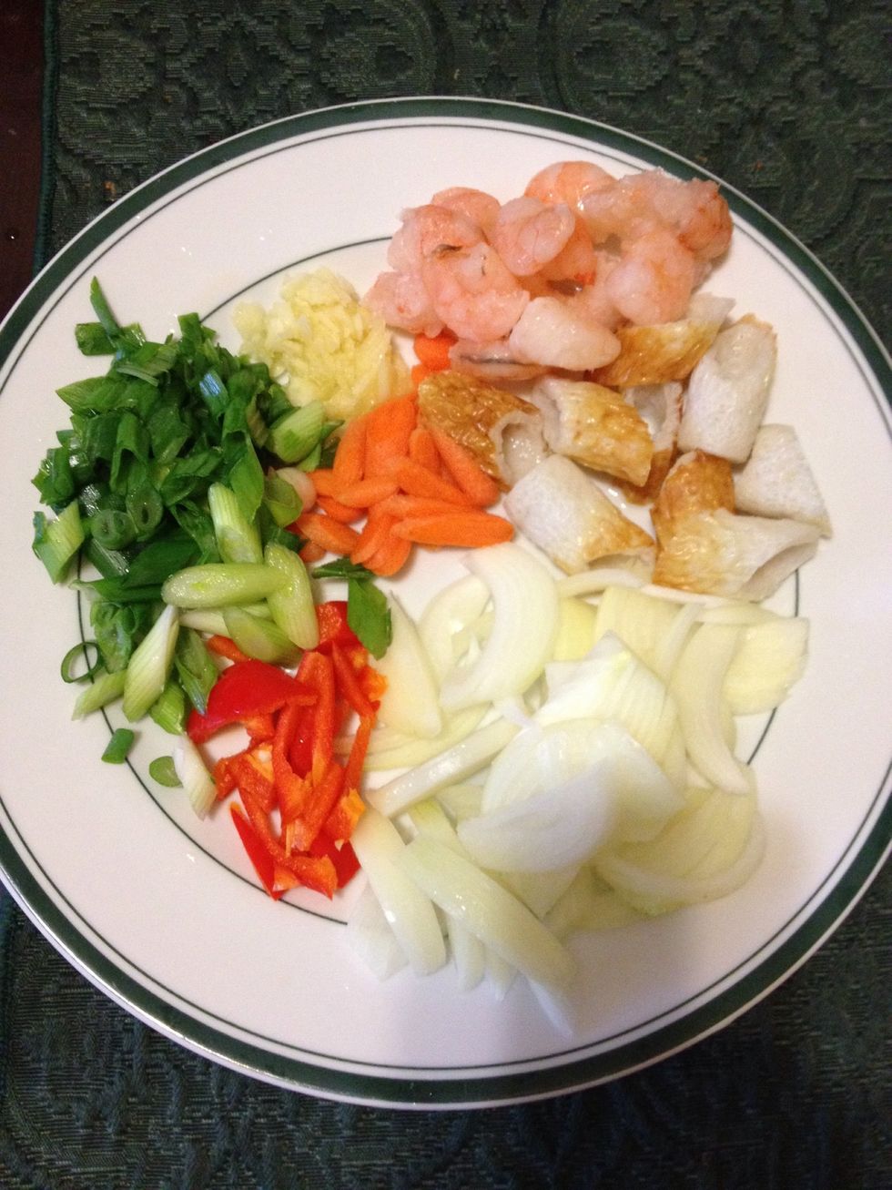 Boil 2 cups of water in a pot. Meanwhile, chop all the vegetables and set them aside.
