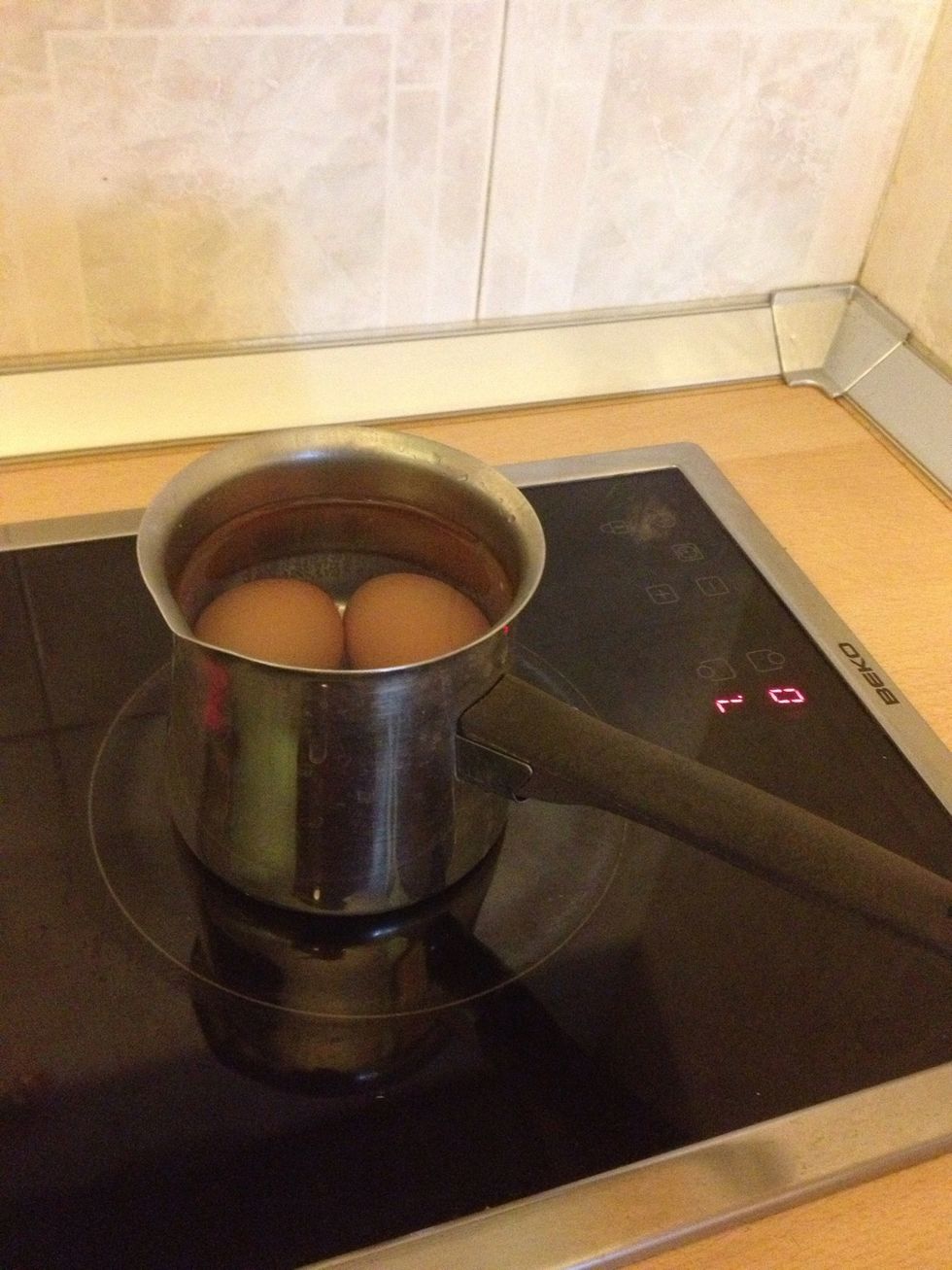 Boil 2 eggs.