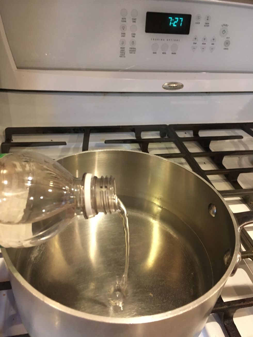 Boil 2 inches of water with a splash of vinegar (about 1 teaspoon)
