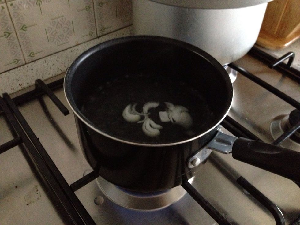 Boil 3 cups of water with cuts onions (or if u have spring onions add too) (next pictures will be the ingredients u need)