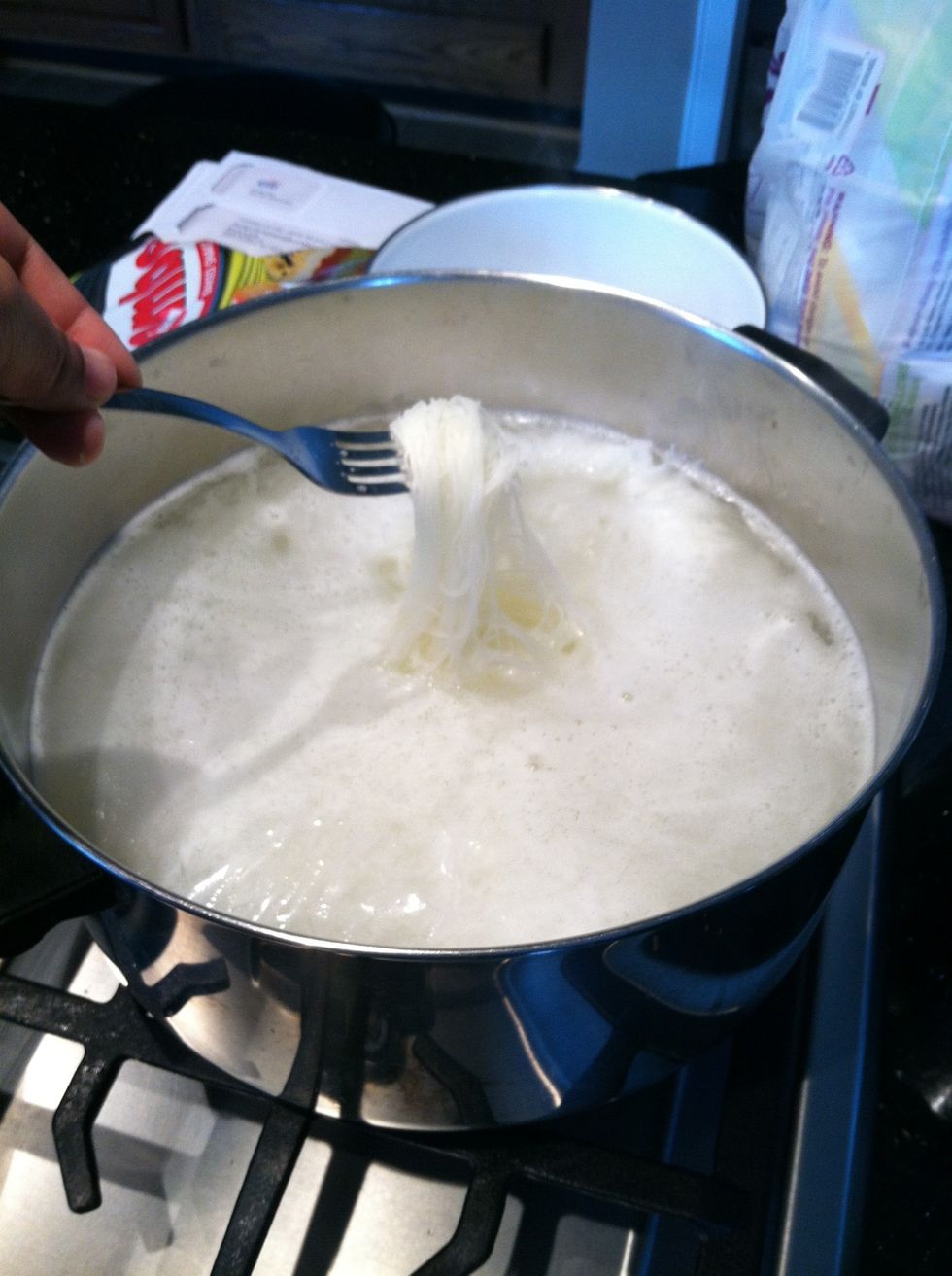 Boil 4 cups of water and add the rice noodles, let them cook for 10 minutes and then drain the water out.