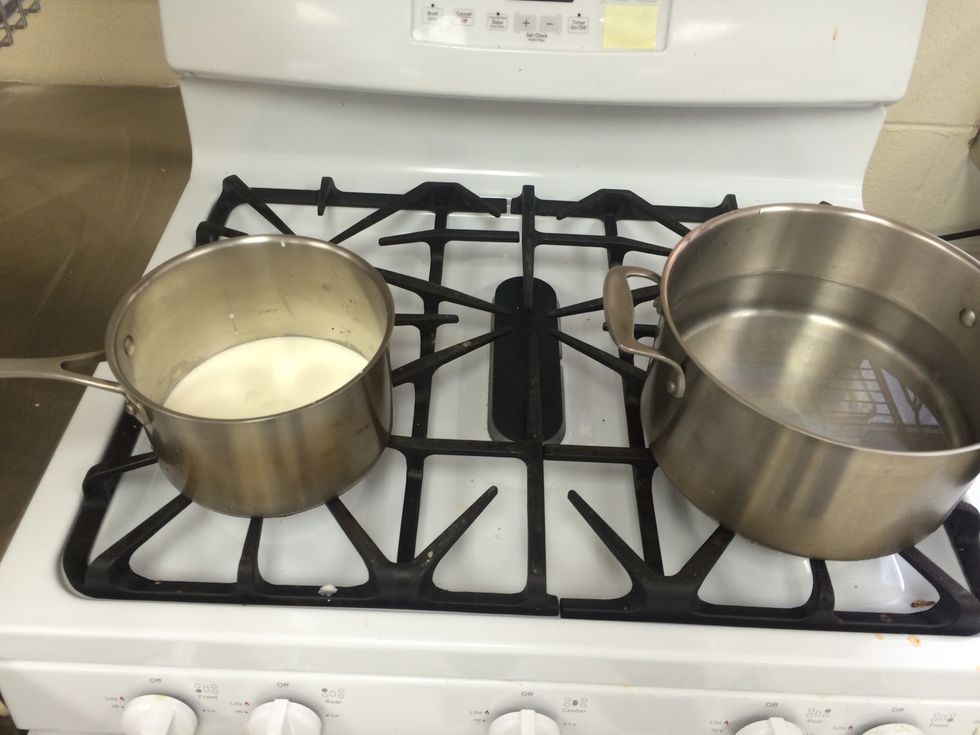 boil a large pot of water on stove and in a separate saucepan, bring heavy cream to a simmer