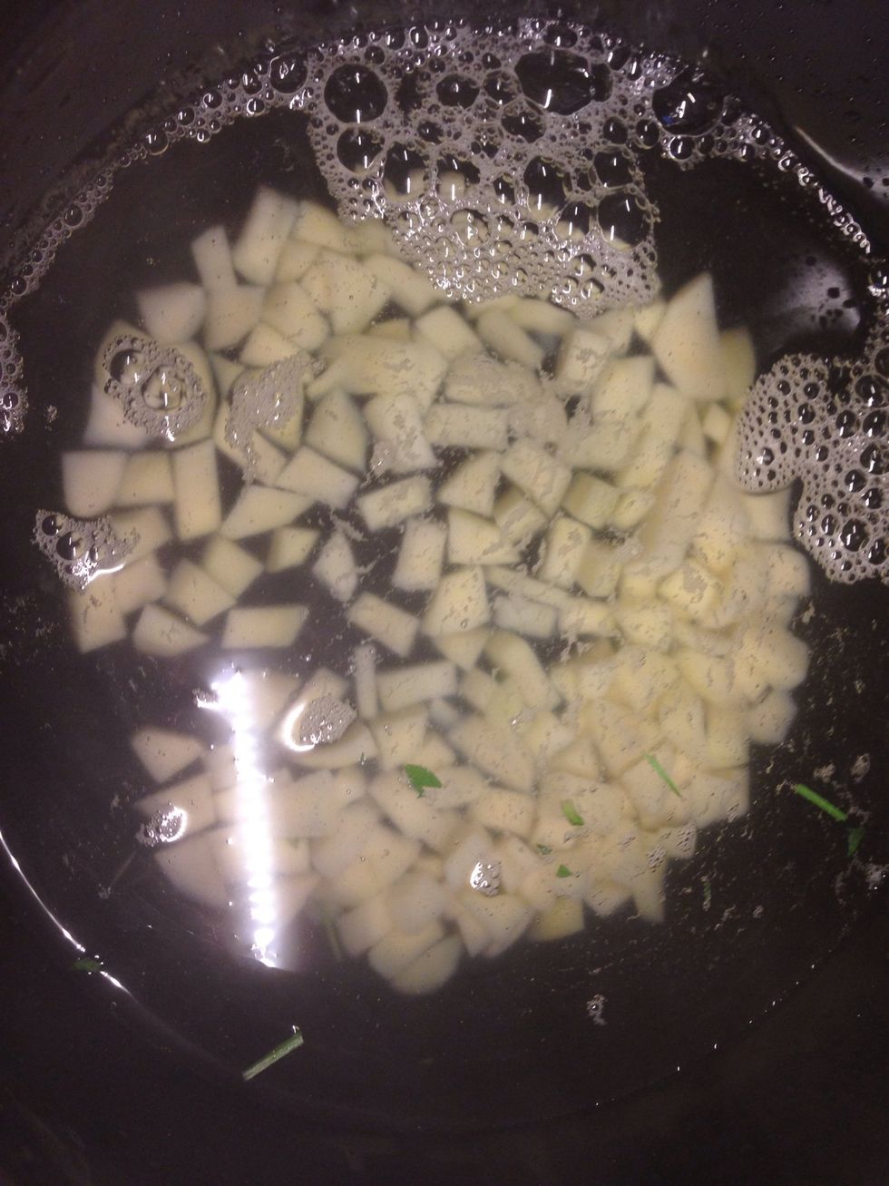 Boil about 2 liters of water (I boil in an electric teapot). Meanwhile peel ur potatoes and cut them to cubes