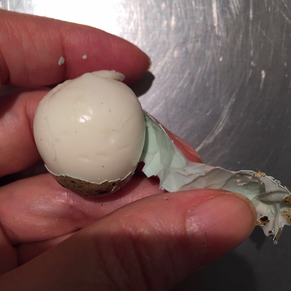 Boil and peel the quail eggs