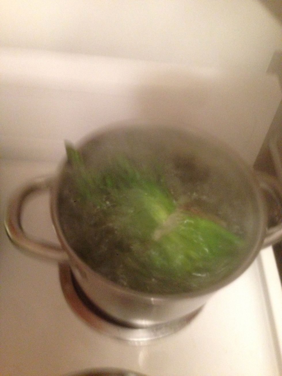 Boil asparagus 7-10 min buy trying to keep "head" out of water. An asparagus net/pan is the must but you can try to old them by binding them with a string