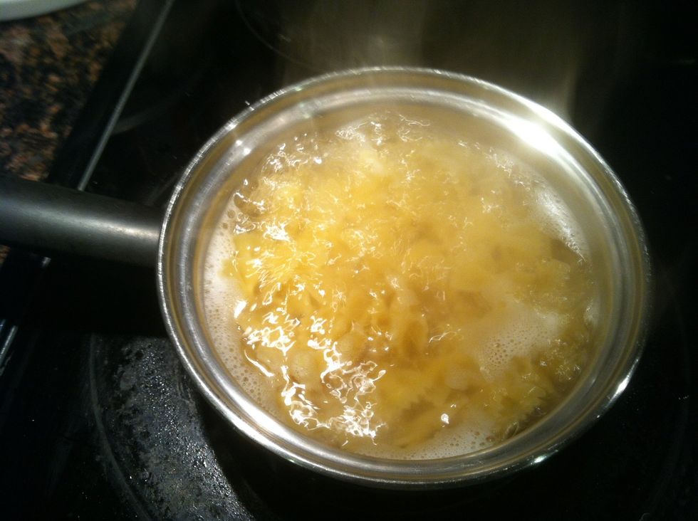 Boil bow tie pasta until tender.