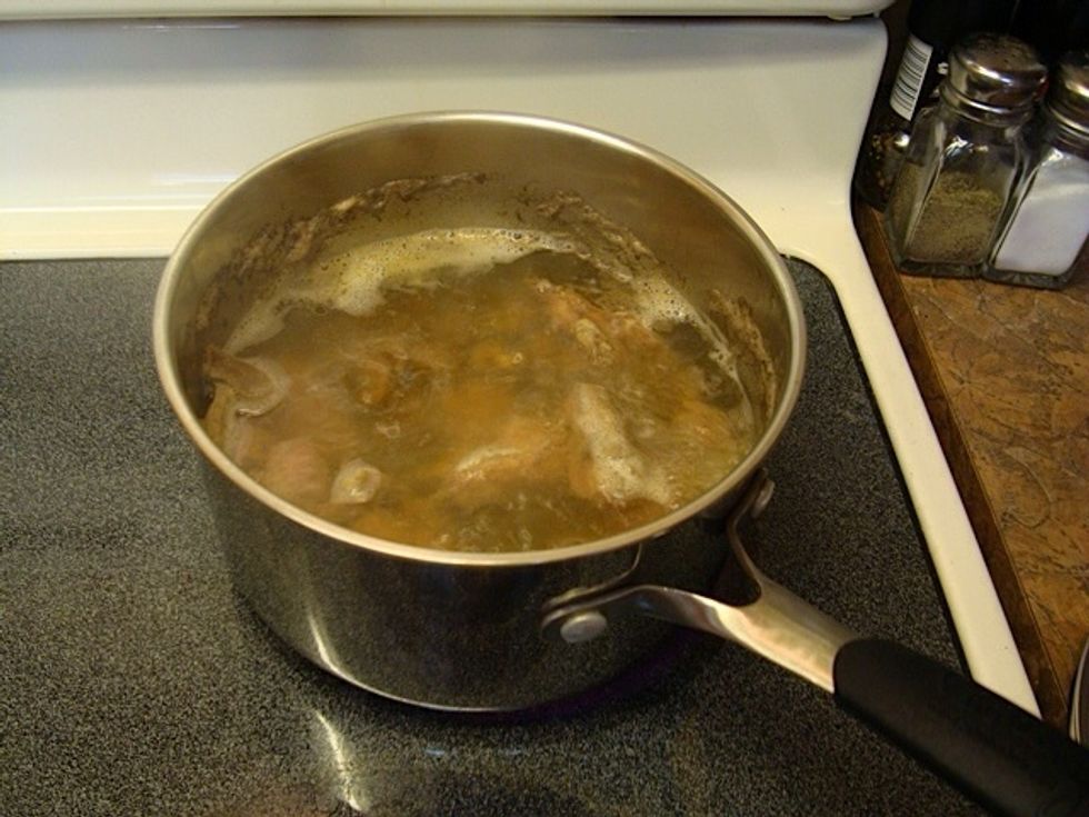 Boil Giblets (found bagged inside turkey) in small saucepan 2/3 full of water till tender. Test w/knife. Gizzard will have some tough parts you'll discard. SAVE THIS LIQIID after cooking and let cool.