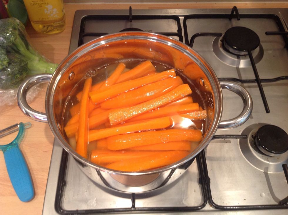 Boil in salted water until a knife goes through the carrots