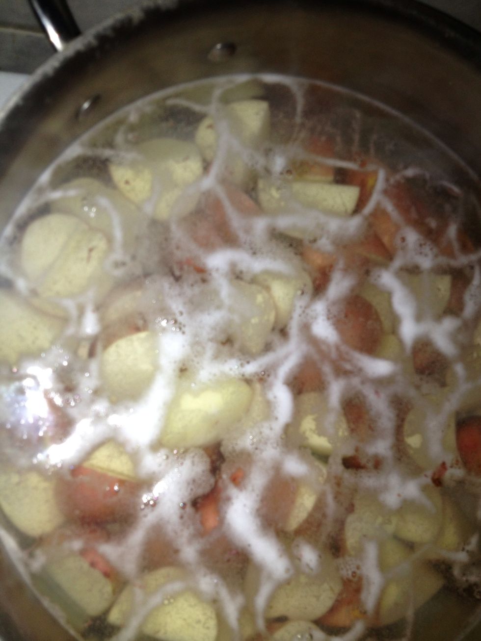 Boil potatoes not to we'll done sturdy enough to not mash just fork tender or medium salt water with 1 1/2 tablespoons 3 cups water