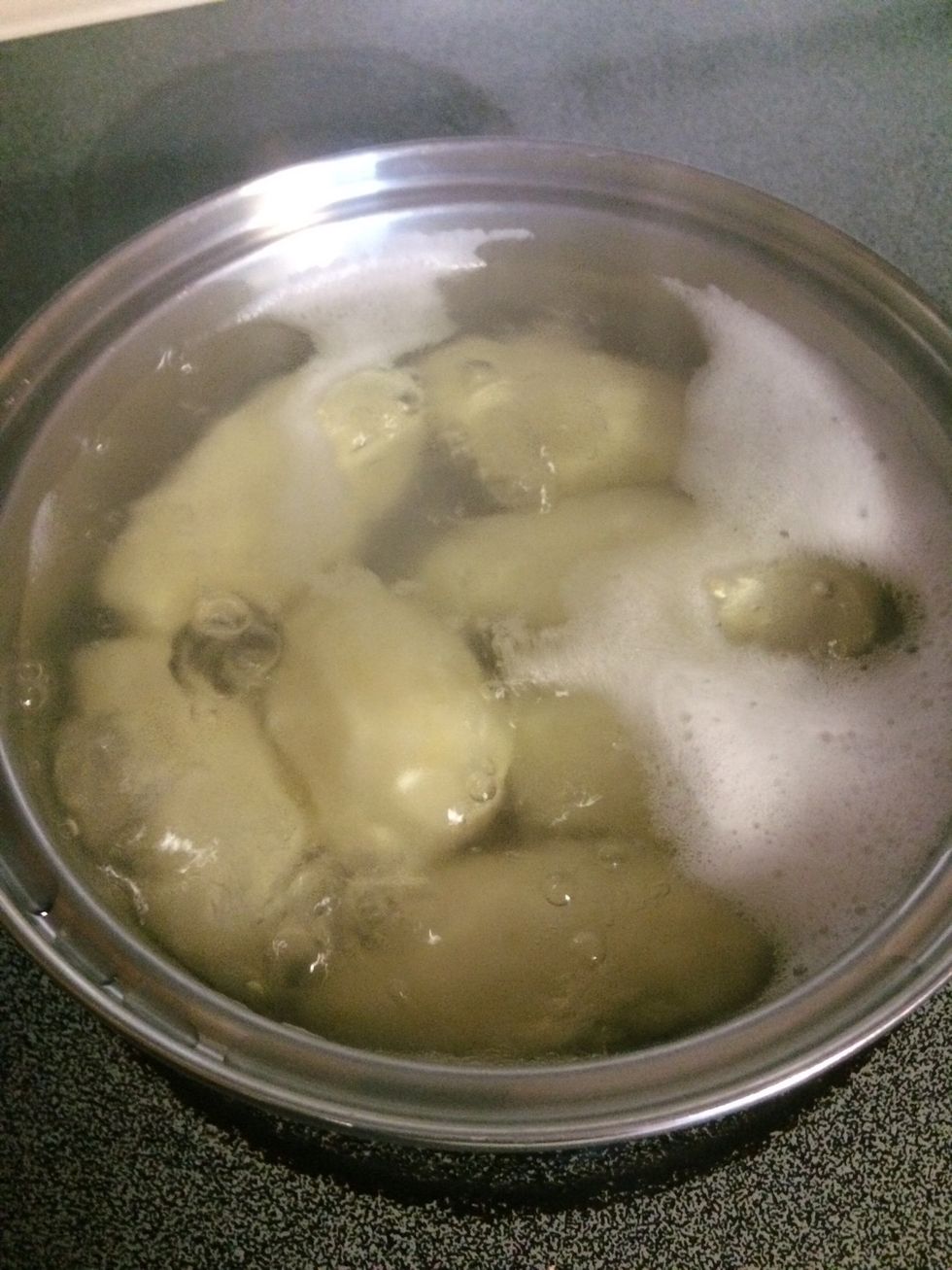 Boil potatoes until they can be poked easily to the center.
