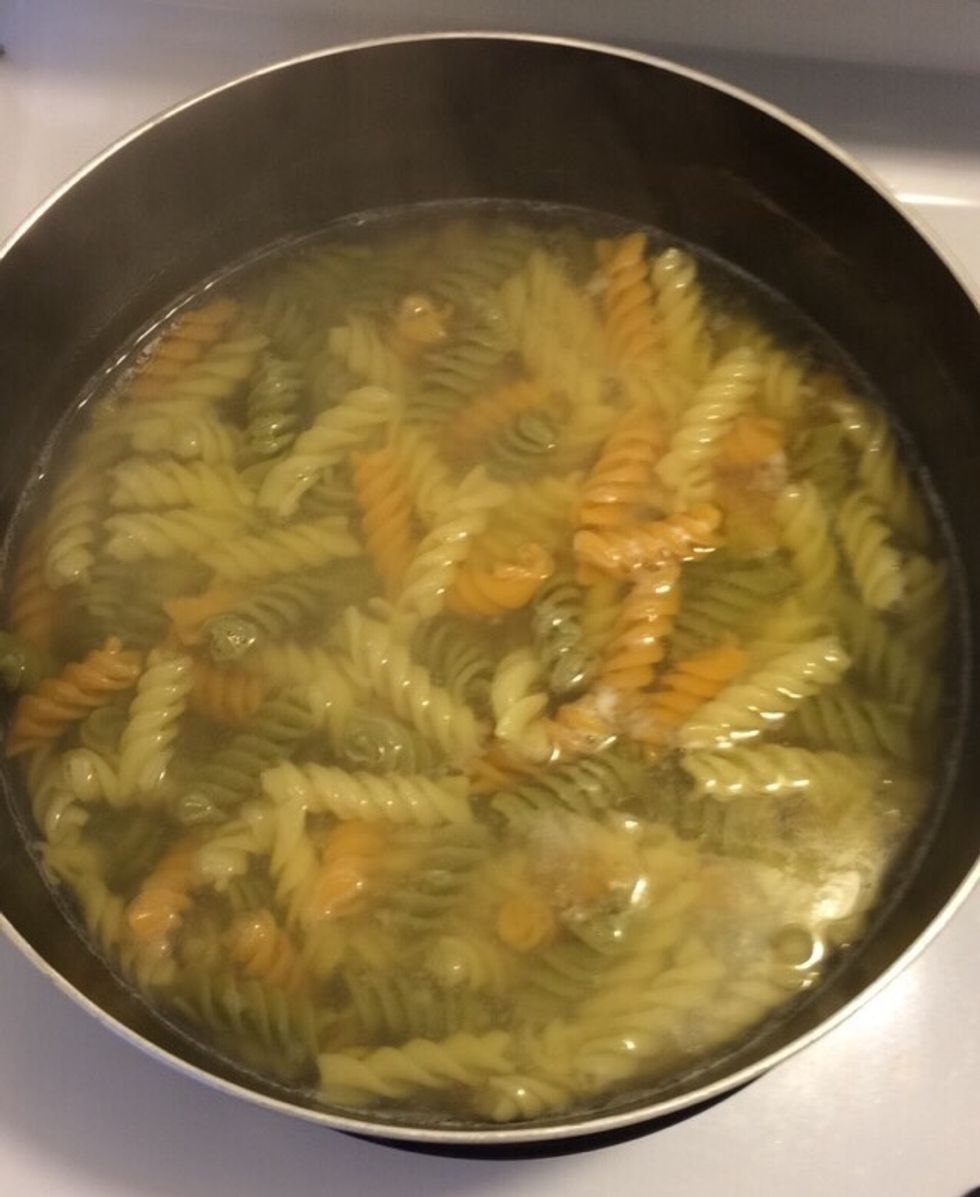 Boil rotini noodles for 10-12 minutes (el dente)