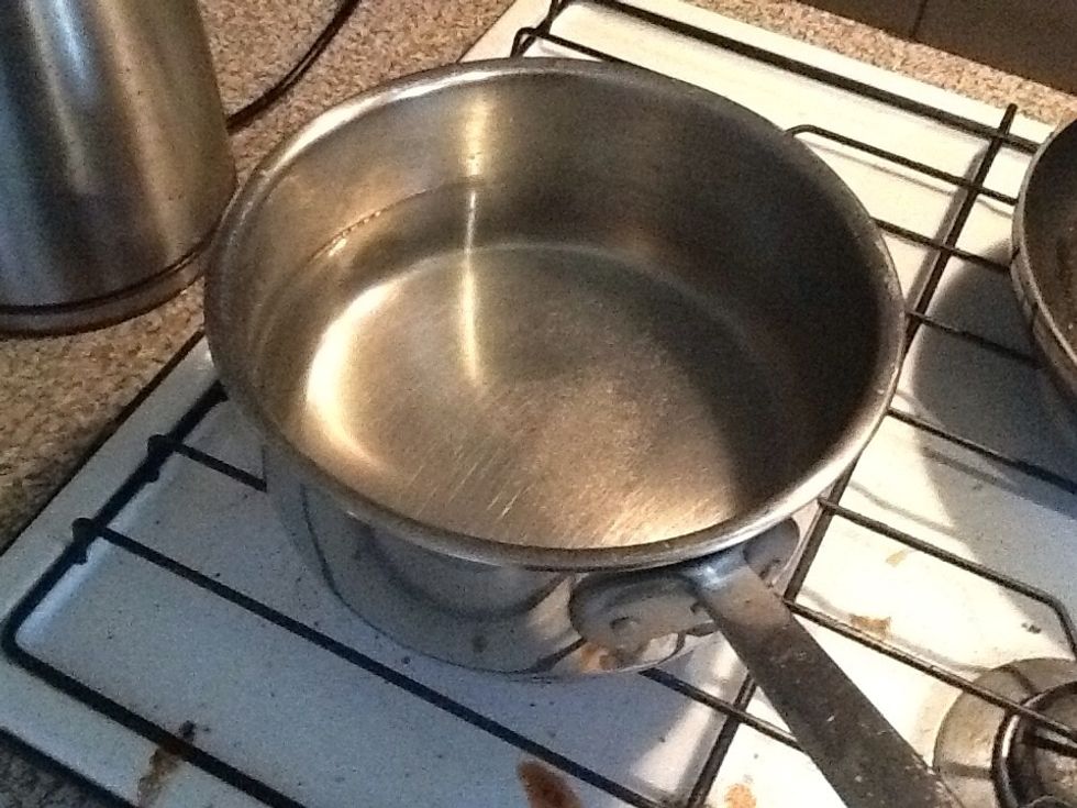 Boil some water and add Salt and Pepper.