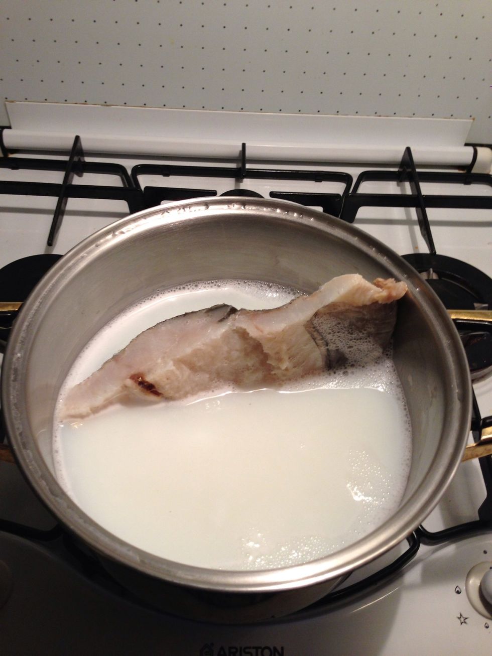 Boil some water and cook the codfish for about 15 minutes. Add milk to the water for the codfish to acquire a softer taste.