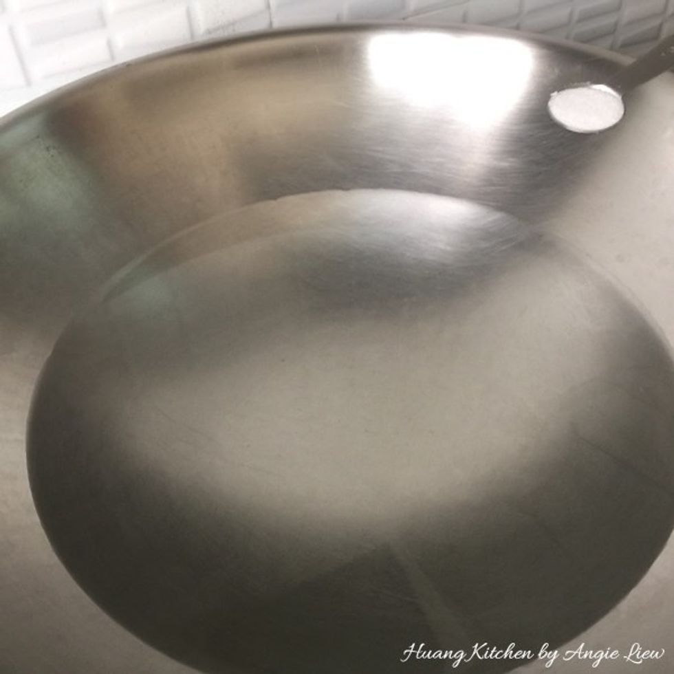 Boil some water in a wok and add in salt.
