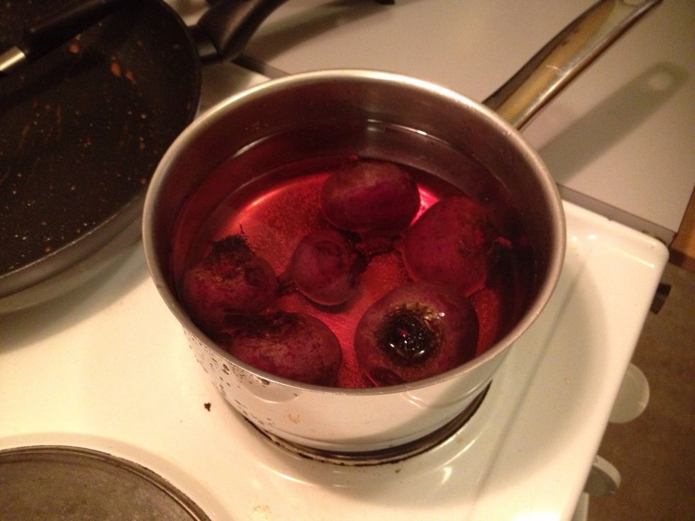 Boil the beetroots for 30 minutes or longer. You shouldn't peel them until they are cooked. As soon as they are soft, rinse them in cold water.