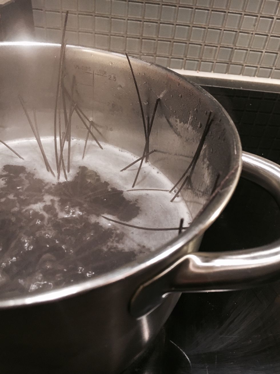Boil the black bean spaghetti