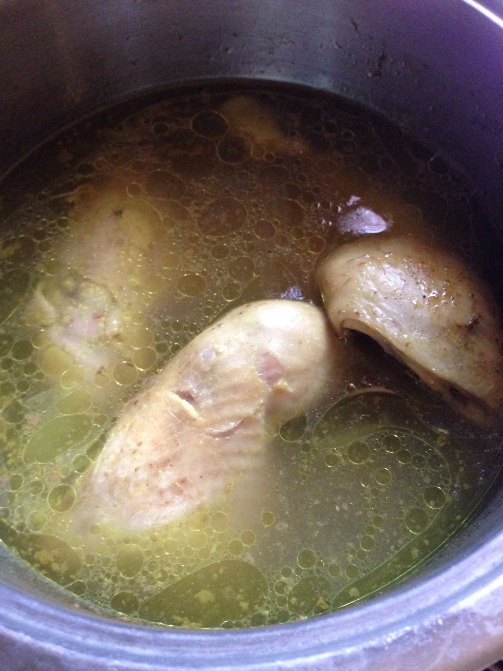 Boil the chicken pieces for 20 mins with your preferred spices, onion, garlic, and bay leaves.