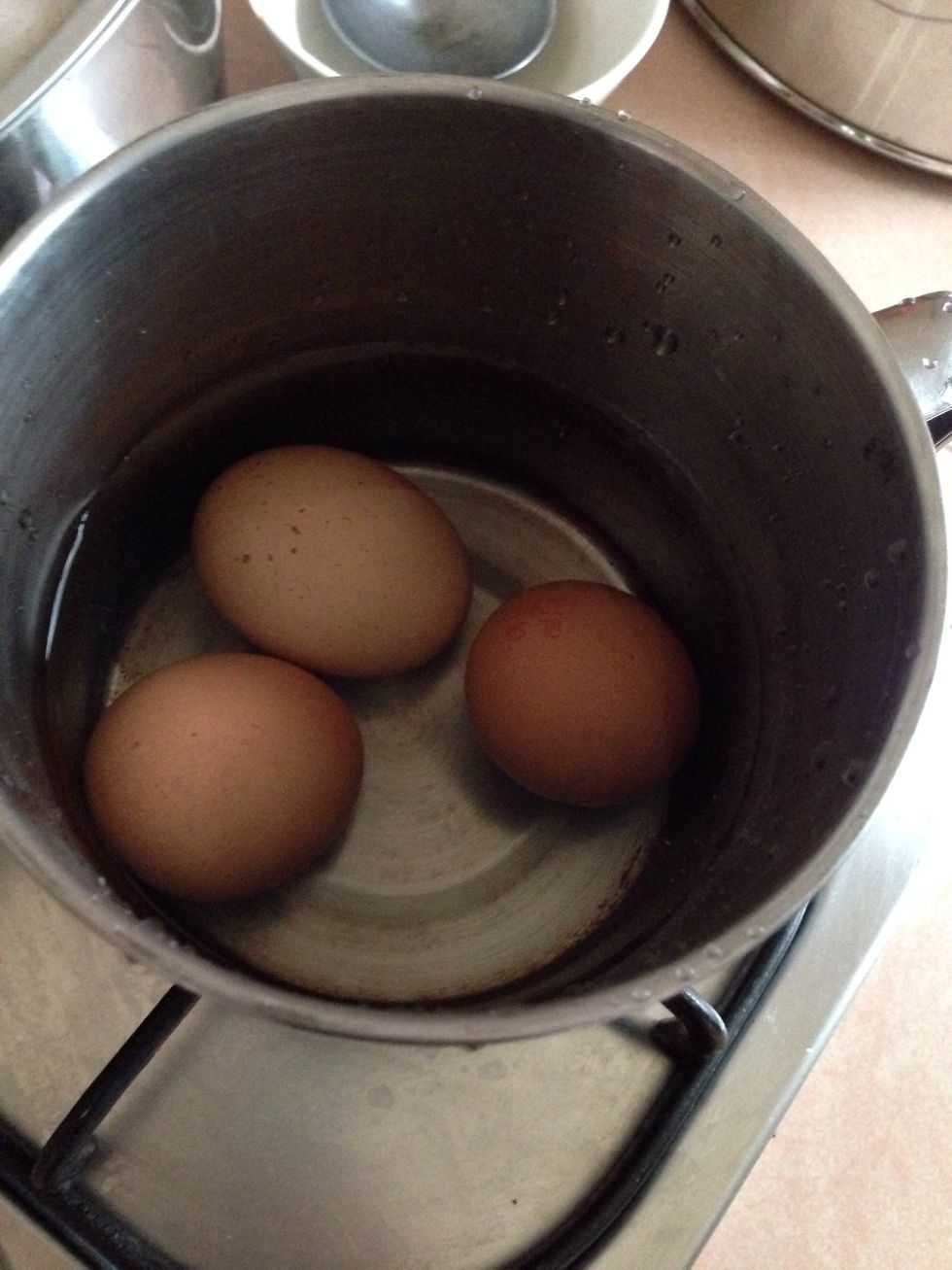 Boil the eggs for 15mins with medium heat