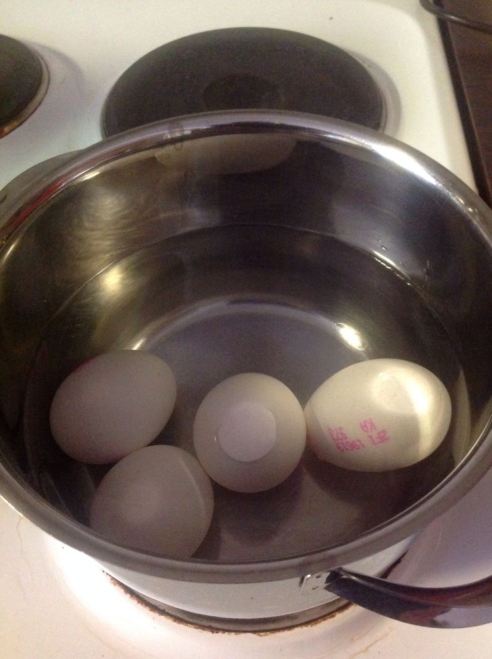 Boil the eggs in water.