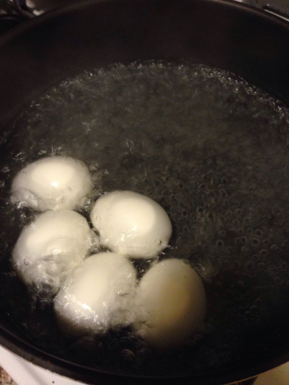 Boil the eggs. Place the eggs in a saucepan and add water. Also add some Salt to the water. (The salt will help with peeling the egg shells off) Bring the heat to high and boil for 10 to 15 minuets.