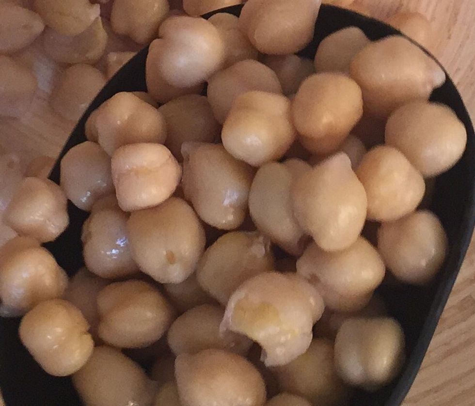 Boil the garbanzo beans. Or bought already boiled