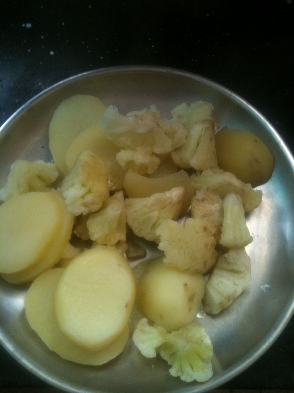 Boil the Potatoes and Cauliflower till soft. Cut the potatoes however you want to. I had precut cauliflower so what I did was to add the potatoes to the Cauliflower.