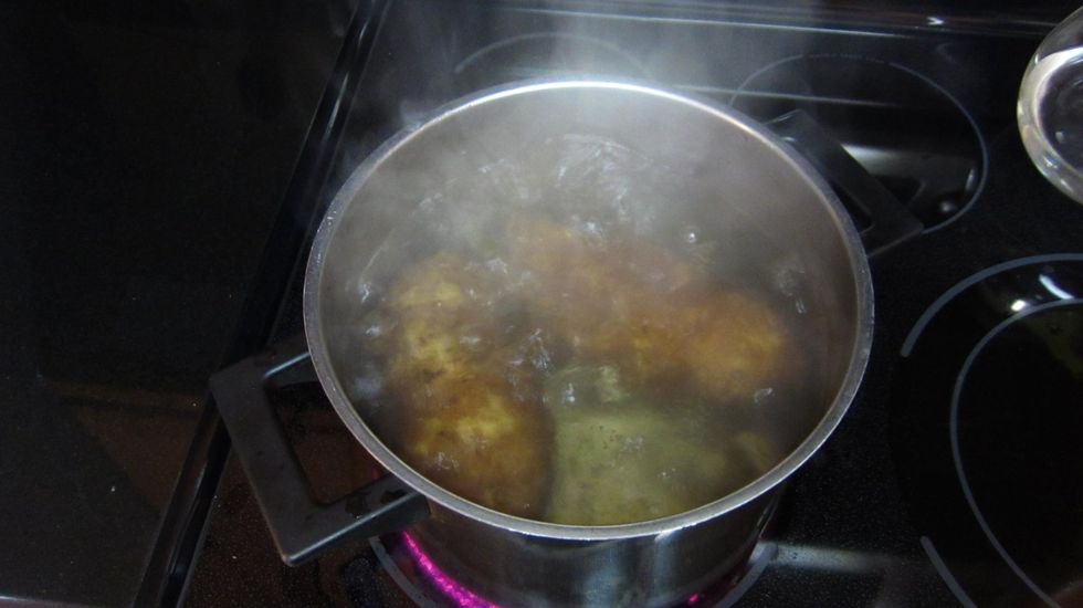 Boil the potatoes first. If you cover the lid they cook faster. About 30 minutes but depends on the size of the potato. We prefer to boil with the skin and then peel after.