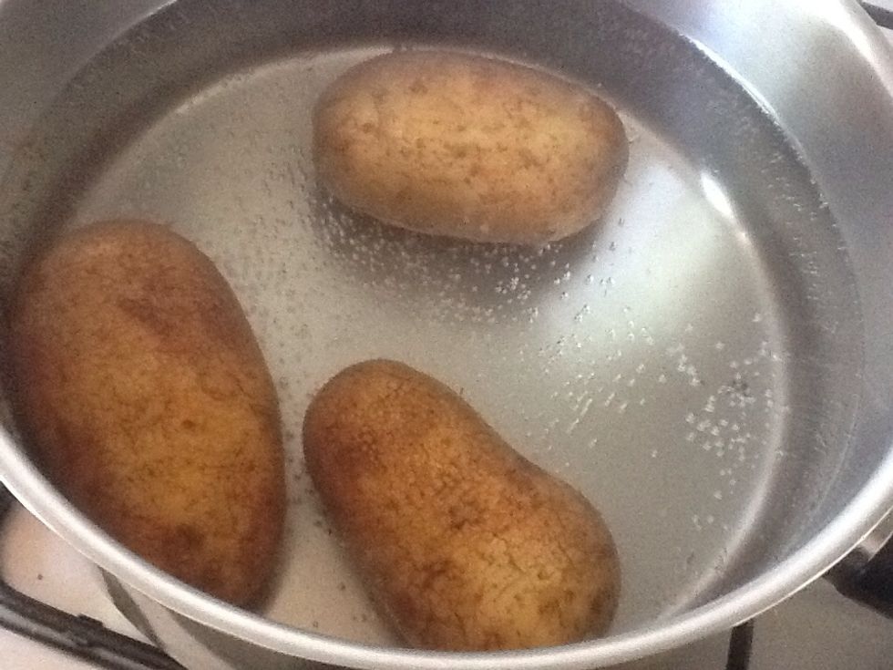 Boil the potatoes.