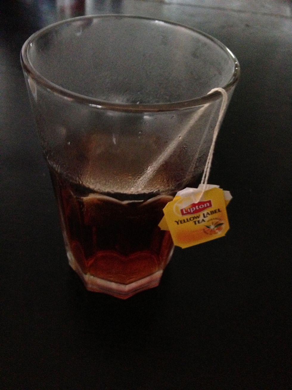 Boil the water and after it reaches a boil, use half the glass, add in the tea to brew. Personally I use two bags of tea. I just preferred a strong flavored cuppa tea. Leave it for 5 - 7 minutes.