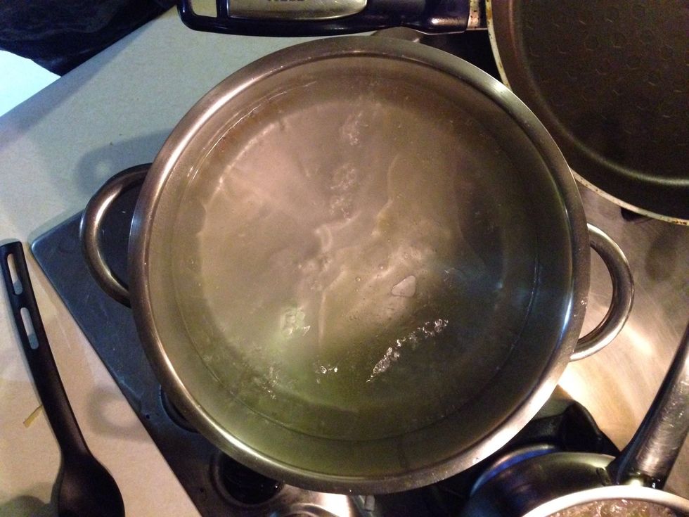 Boil the water in a deep pan with some salt and olive oil but really wait until it's boiling