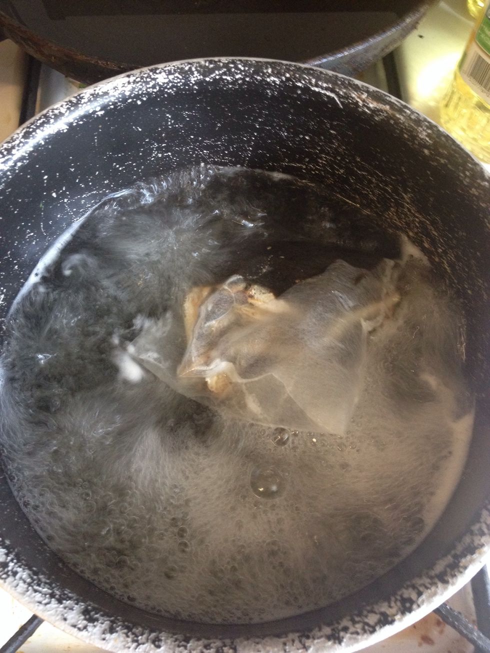 Boil the water. Put in to fill 1/2 of the regular size pot. This will serve about 2-3 people. I put pre-packed anchovie broth pack to make that seafood, hearty broth