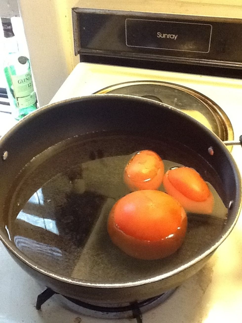 Boil tomatoes in a vessel