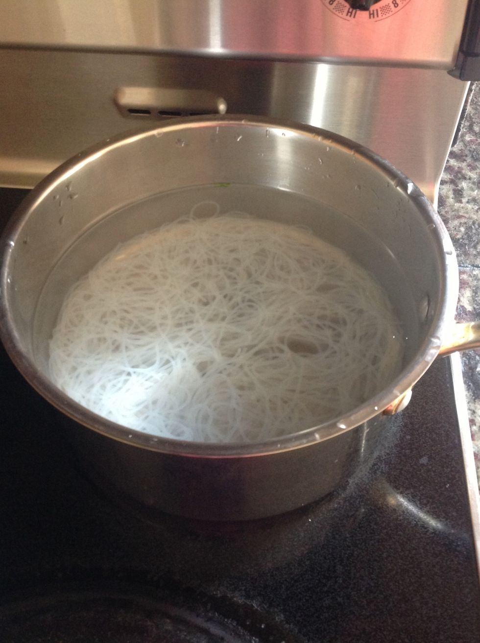 Boil two bundles of rice noodle in large pot of water.