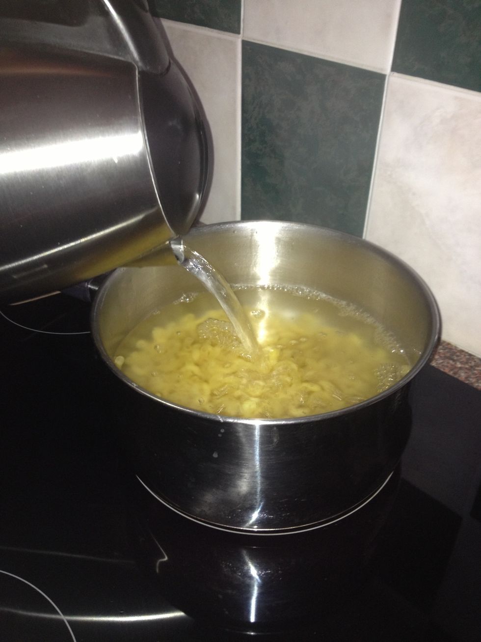 Boil up 250 grams of pasta, any will do but macaroni shaped is best for making... Well... Macaroni!