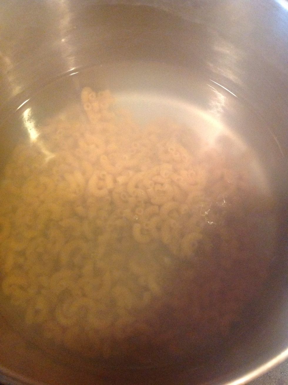 Boil water and add the macaroni till it is cooked.