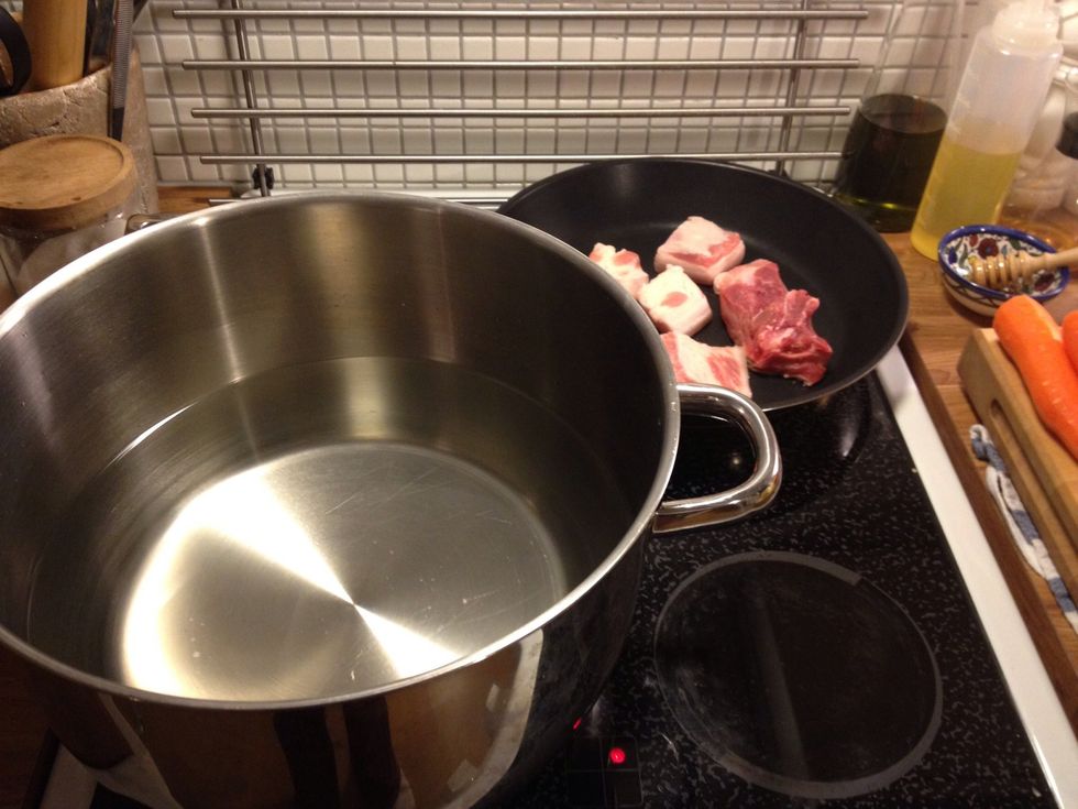 Boil water and fry the pork fat.