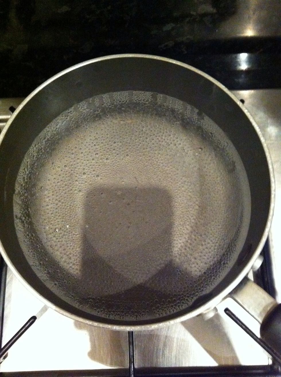 Boil water in a medium sized pot, add some salt and cook the macaroni following the guidelines on the packet. Drain when finished and cool in cold water to stop it cooking and prevent sticking