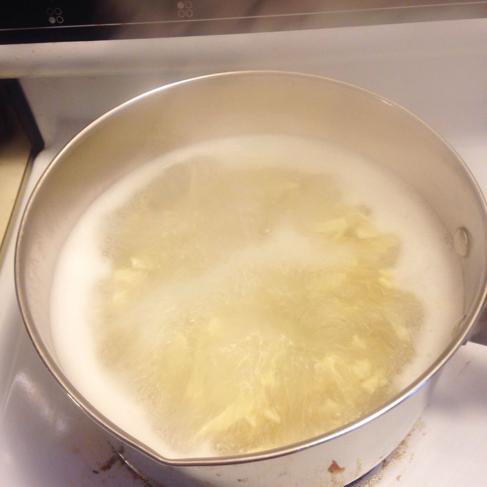 Boil water in a pot or saucepan with a bit of salt. Cook noodles according to the time listed on the package.