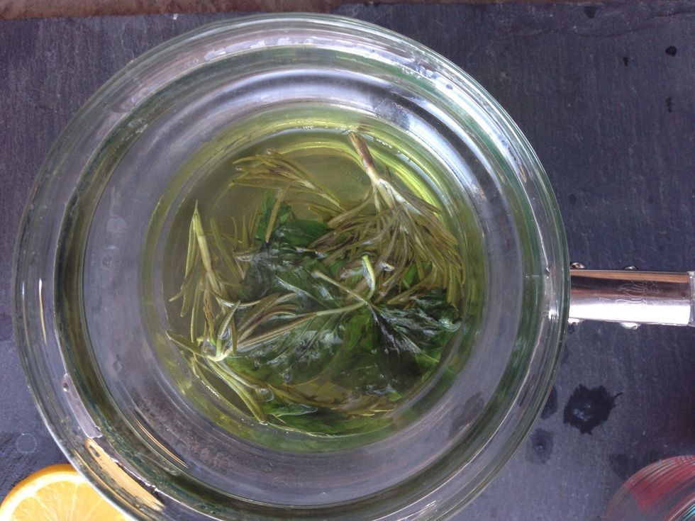 Boil water, sugar, rosemary, and basil in a saucepan. Then turn to low heat and let simmer for ten minutes.