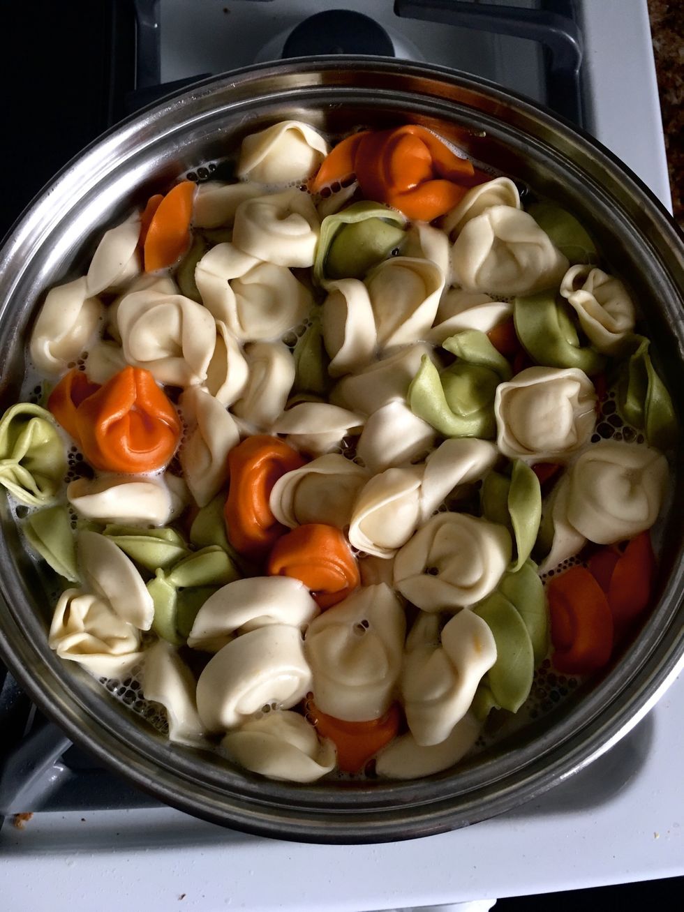 Boil water then add your tortellini noodles. I used "tortellini buitoni trio"