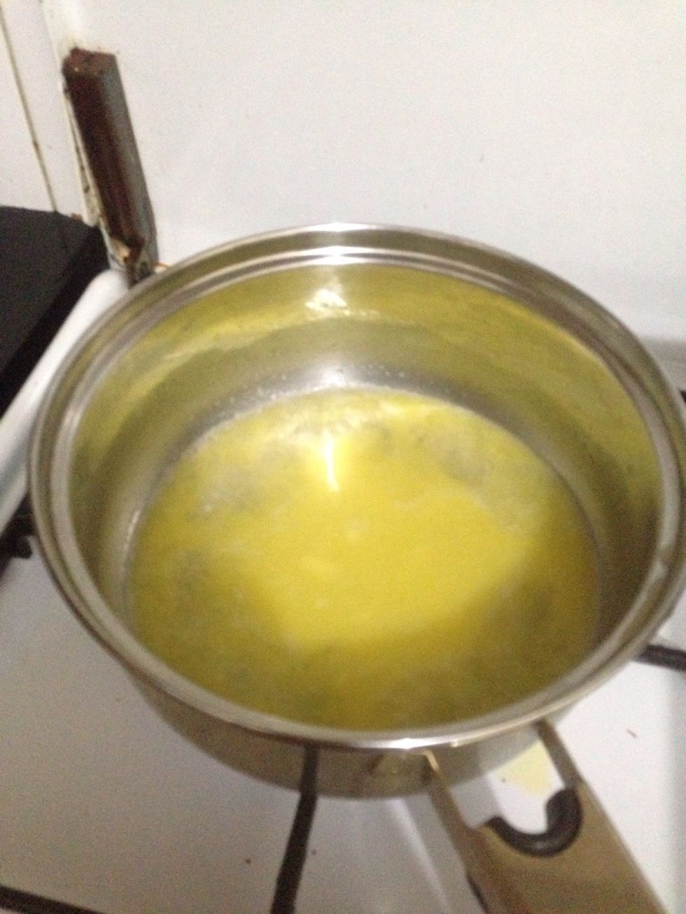 Boil water together with butter in the saucepan over medium-high heat