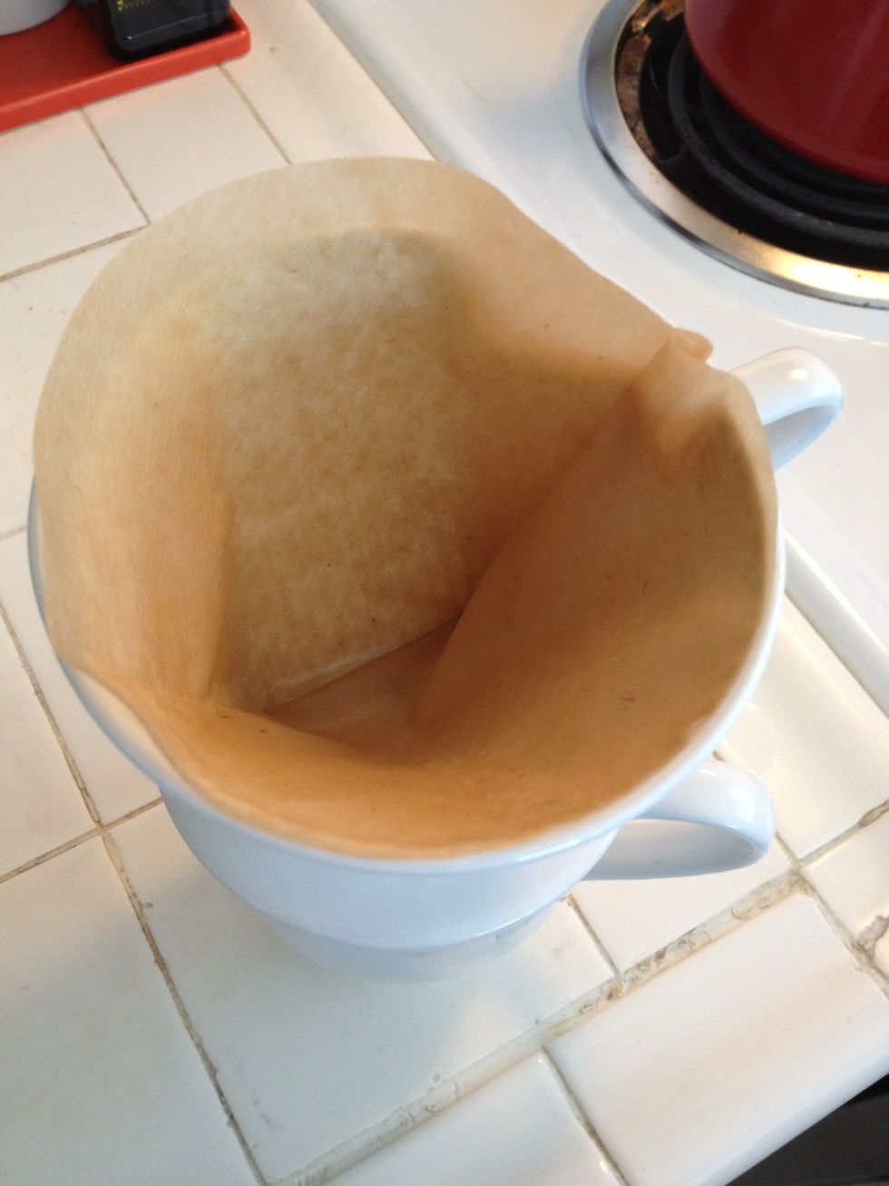 Boil your water to between 195 and 205 degrees. Pour a little water onto the filter to wet it. Make sure you discard the water from your mug.